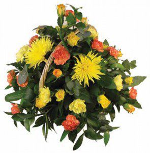 Yellow and orange floral arrangement - Swanborough Funerals