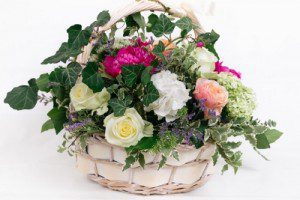 floral arrangement in a basket - Swanborough Funerals